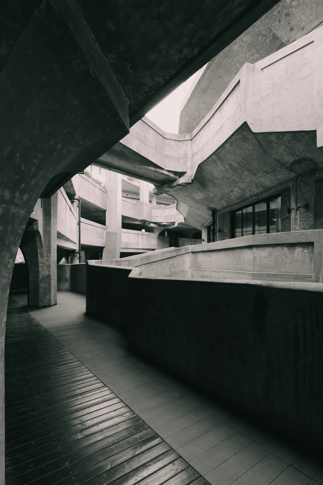 Concrete walkway and columns in a brutalist interior