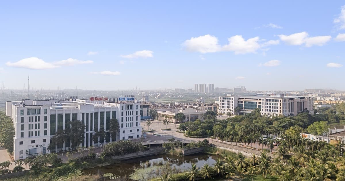 Aerial view of the Sandhya Infocity IT campus in Navalur, Chennai, the HCL-anchored blocks set beside the campus lake